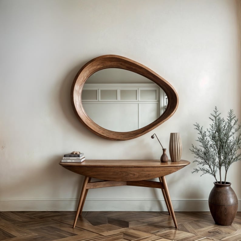 The wall hanging  mirror that will add a modern touch to your entrance. The wavy-edged wooden frame mirror reflects light perfectly, making your space look larger and more spacious.