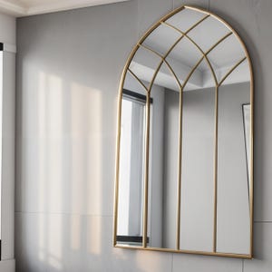 The abstract mirror will add a modern atmosphere to your spaces. The handmade fireplace mirror offers a unique aesthetic to your space thanks to its original design.