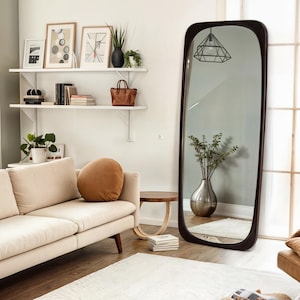 The wooden frame mirror that will add a modern touch to your entrance. The large wooden frame mirror reflects light perfectly, making your space look larger and more spacious.
