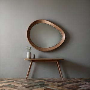 Always look perfect with the round wood mirror that will illuminate your makeup routine. Designed like a piece of decorative art, the organic mirror fits easily into bohemian, modern or minimal styles.