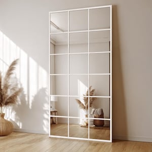 Reflect your style with asymmetrical tall mirror, which is the perfect decorative option for your bedroom. The organic form mirror with gold edging adds sophistication to modern and luxurious interiors.