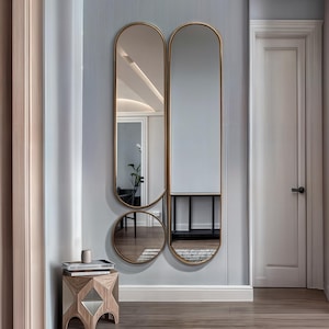 Both aesthetic and functional gold framed mirror will be indispensable for your bedroom. 
The minimalist full body decorative wall mirror goes well with both classic and contemporary decor styles.