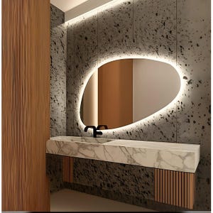 The bedroom LED Mirror, which attracts attention with its modern design, is the best option to reflect your style. The warm white LED lighting adds a pleasant ambience to your environment.