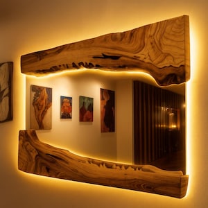 Artistic wooden wall mirror featuring organic grain and ambient light, designed for cozy interiors