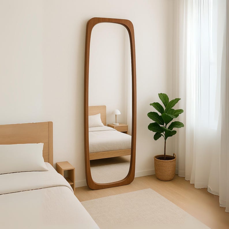The vanity floor mirror will add a modern atmosphere to your spaces.
The abstract mirror with wood frame is ideal for creating a simple yet impressive atmosphere.