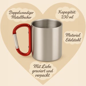 May include: A stainless steel mug with a red carabiner handle. The mug has a capacity of 230 ml. Text on the image reads: "Double-walled metal mug", "Capacity: 230 ml", "Material: Stainless steel", and "Engraved and packaged with love."