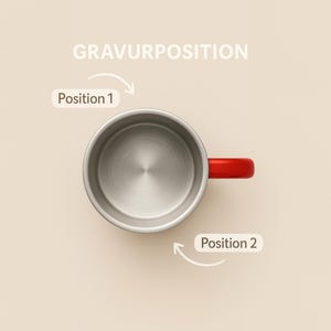 May include: Overhead view of a stainless steel mug with a red handle. The text "GRAVURPOSITION" is at the top, with "Position 1" and "Position 2" labels and arrows indicating placement options.