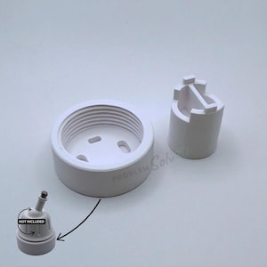 May include: White plastic electrical components, including a circular base with screw threads, a cylindrical piece, and a small component labeled "NOT INCLUDED". The image has the text "PROBLEM SOLVED".