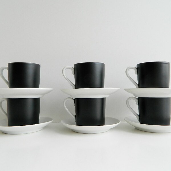 Black and white espresso or demitasse cups and saucers