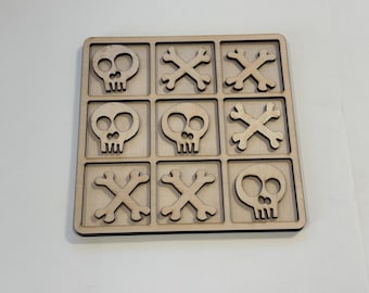 May include: A wooden tic-tac-toe game with a skull and crossbones design. The game board is divided into nine squares, and each square has a skull or crossbones image.