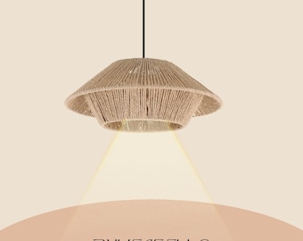 May include: A beige, woven rope pendant light fixture. The light has a tiered, inverted-bowl shape with a black cord. The light is suspended from the ceiling, casting a warm glow below. The text "BUYENSELLC" is at the bottom.