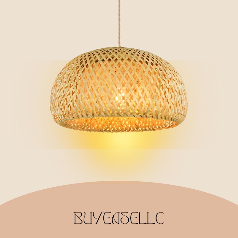 May include: A woven bamboo pendant light. The light has a rounded, dome shape with a lattice design. It is suspended from a natural fibre cord. The light emits a warm, yellow glow. The text "BUYENSELLC" is at the bottom.