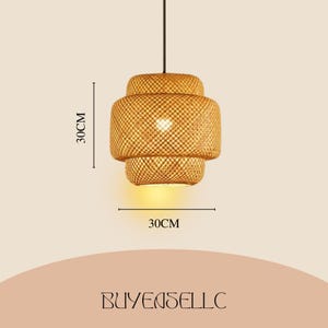 May include: A woven bamboo pendant light, 30cm in diameter and 30cm high. The light has a layered design and emits a warm glow. The text "BUYENSELLC" is at the bottom.