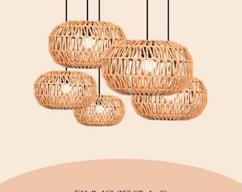 May include: Five pendant lights with woven, spherical shades. The shades are made of a light brown material, with a textured, open weave design. Each light has a black cord. The text "BUYENSELLC" is at the bottom.