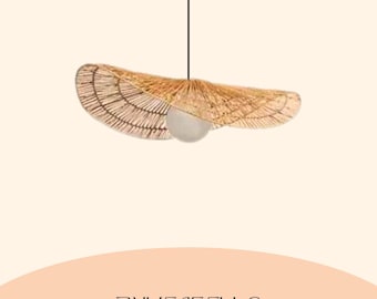 May include: A woven, natural-toned pendant light fixture with a unique, open design. The light has a wide, curved shape with a central bulb. The fixture is suspended from a black cord against a neutral background. The text "BUYENSELLC" is at the bottom.