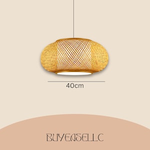 May include: A woven bamboo pendant light fixture. The light is an oval shape, 40cm in diameter, with a woven pattern and a white interior. The light hangs from a single black cord.