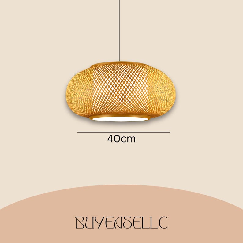 May include: A woven bamboo pendant light fixture. The light is an oval shape, 40cm in diameter, with a woven pattern and a white interior. The light hangs from a single black cord.