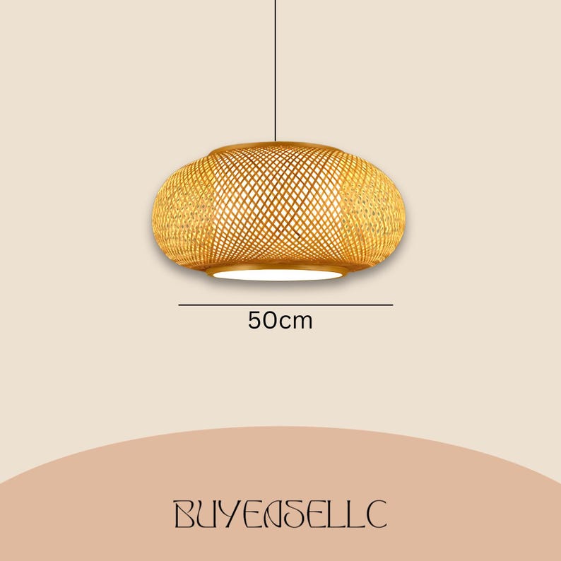 May include: A woven rattan pendant light fixture. The light is oval-shaped, with a diameter of 50cm. The light is suspended from a black cord and emits a warm glow. The fixture has a natural, light brown color and a woven pattern.