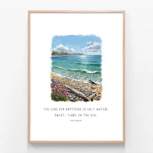 May include: A framed art print featuring a coastal scene with a pebble beach, turquoise waves, a small bird, and pink flowers. Below the illustration, the text reads: THE CURE FOR ANYTHING IS SALT WATER: SWEAT, TEARS, OR THE SEA. - ISAK DINESEN -