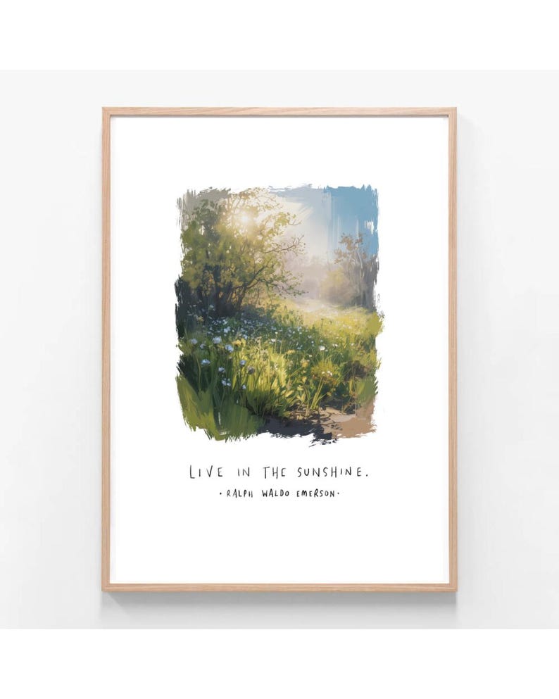 May include: A framed art print featuring a vibrant landscape painting. The artwork depicts a sunlit meadow with wildflowers and trees. The text "LIVE IN THE SUNSHINE" and a quote by Ralph Waldo Emerson are printed below the image.