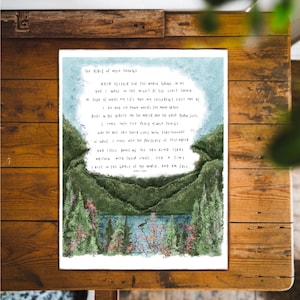 May include: A watercolour illustration of a forest scene with a lake and a bird. The text reads "The Place of Wild Things" and includes a poem about finding peace in nature.