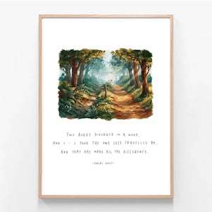 May include: A framed wall art print featuring a painted forest scene with a path splitting into two directions. Below the illustration, the text reads: Two roads diverged in a wood, and I - I took the one less travelled by. And that has made all the difference. - Robert Frost.