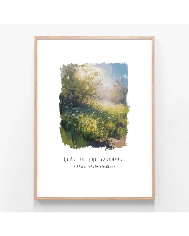 May include: A framed art print featuring a vibrant landscape painting. The artwork depicts a sunlit meadow with wildflowers and trees. The text "LIVE IN THE SUNSHINE" and a quote by Ralph Waldo Emerson are printed below the image.
