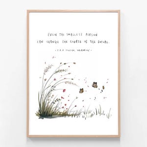 May include: A framed art print with a quote: "EVEN THE SMALLEST PERSON CAN CHANGE THE COURSE OF THE FUTURE." The image shows a watercolour illustration of grass, flowers, and butterflies in green, red, and brown. The quote is by J.R.R. Tolkien.