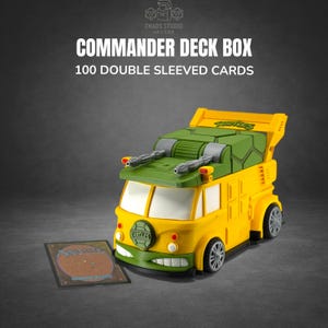 May include: Yellow and green Commander Deck Box shaped like a cartoon van, with the text "COMMANDER DECK BOX 100 DOUBLE SLEEVED CARDS". The box has a green top and silver details. A card is in front of the box.