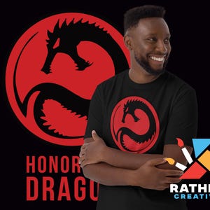 May include: Black t-shirt featuring a red dragon design inside a red circle. The text "HONOR DRAGON" is below the large dragon graphic. A smaller version of the dragon graphic is on the front of the shirt. The shirt is worn by a person.