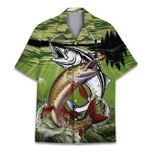 May include: Short-sleeved button-down shirt with a green water background and a graphic of two fish jumping out of the water. One fish is a detailed illustration of a pike, and the other is a white outline of a fish.