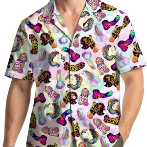 May include: Short-sleeved button-down shirt with a colorful, whimsical pattern. The design features various cartoonish phallic shapes, some with unicorn heads, set against a pastel rainbow background. The shirt has a classic collar and a relaxed fit.