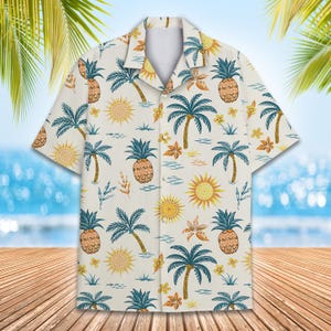 May include: A white short-sleeved button-down shirt with a tropical print featuring palm trees, pineapples, and suns. The shirt has a relaxed fit and a classic collar.