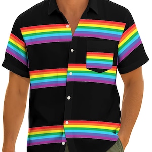 May include: Black short-sleeve shirt with horizontal rainbow stripes. The shirt has a button-down front, a chest pocket with a rainbow stripe design, and a classic collar. The rainbow stripes include red, orange, yellow, green, blue, and purple.