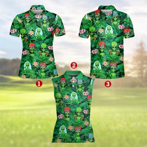 May include: Three golf shirts with a green alien and tropical leaf pattern. The shirts have a collared neckline and short sleeves. The alien design includes a red cap and a spaceship. Pink flowers are scattered throughout the design.