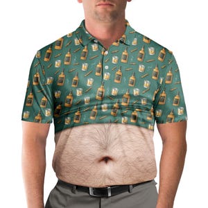 May include: A green polo shirt with a repeating pattern of whiskey bottles, glasses, and cigars. The bottom half of the shirt is a photo of a hairy belly. The shirt has a collared neckline and short sleeves.