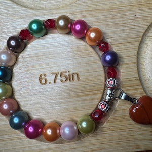 Multi color glass pearl elastic bracelet with a heart  stone charm
