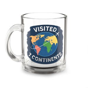 May include: Clear glass coffee mug with a handle. The mug features a blue, orange, yellow, and green world map design with the words "VISITED 7 CONTINENTS" and an airplane graphic.