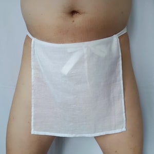 May include: A white cotton loincloth with a bow at the front.