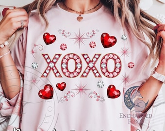 May include: A light pink t-shirt with the word "XOXO" in a jeweled design, surrounded by red heart and diamond accents. The shirt also features the text "Pngs" and "Instant Download".