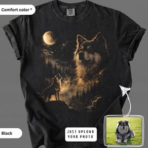 May include: A black short-sleeve t-shirt featuring a graphic print of a dog looking up at a full moon in a starry night sky with a forest landscape. The shirt includes a small inset box showing a dog on grass with the text JUST UPLOAD YOUR PHOTO.