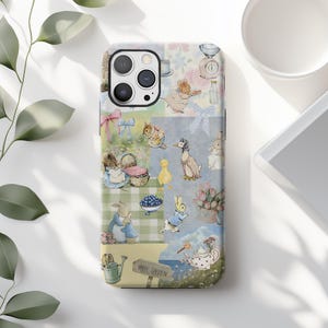 May include: A phone case featuring a collage of watercolor illustrations of bunnies, ducks, and other animals in a garden setting. The case has a light blue, pink, and green color scheme, with the words "HAY GARDEN" on a sign.