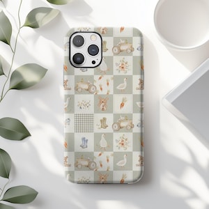 May include: A phone case featuring a patchwork design with farm-themed illustrations. The pattern includes tractors, geese, carrots, boots, and floral elements in a soft, muted color palette. The case is designed to fit a smartphone.