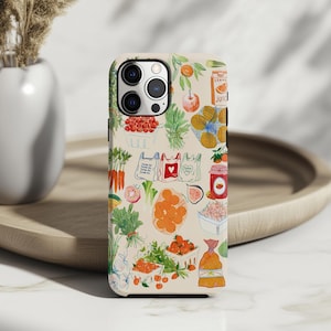 May include: A beige phone case featuring a colorful illustration of various fruits and vegetables, including oranges, tomatoes, and carrots. The design includes shopping bags and a jar of jam, creating a farmer's market theme.