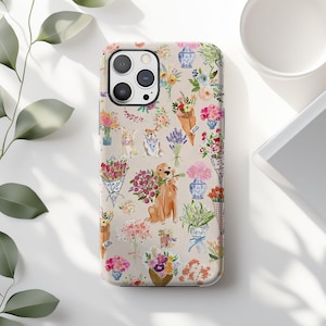 May include: A phone case featuring a repeating pattern of watercolor bouquets, vases, and dogs. The design includes a golden retriever holding flowers, along with various floral arrangements in shades of pink, yellow, and blue. The case has a glossy finish.