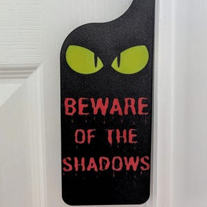 Spooky Halloween Door Sign: Creepy Yellow Eyes Decor