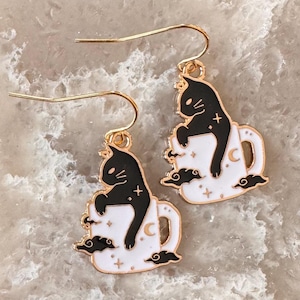 black cat in a celestial mug dangle earrings