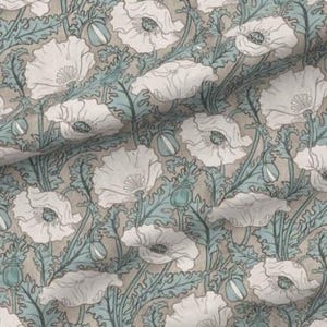May include: Fabric with a repeating floral pattern featuring large white poppy flowers, green leaves, and buds on a light blue and tan background. The design has a vintage, botanical aesthetic.