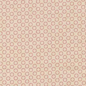 May include: A beige fabric with a repeating pattern of small, red circles. The circles are evenly spaced across the fabric's surface. The fabric has a subtle texture and a ruler is at the bottom.