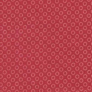 May include: Red fabric with a repeating pattern of small, light pink circles. The fabric has a textured appearance and is suitable for quilting or other craft projects. A ruler is at the bottom of the image.